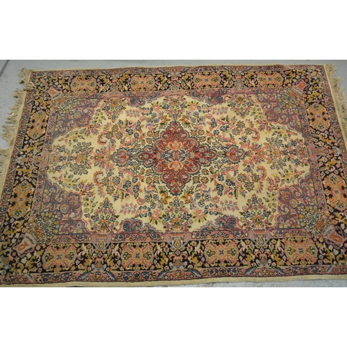 143 - Tabriz rug, the central medallion and multiple borders on a beige ground, 182 x 124cm