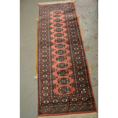 149 - Small Pakistan runner of Turkoman design, 170 x 62, together with a similar smaller beige ground rug