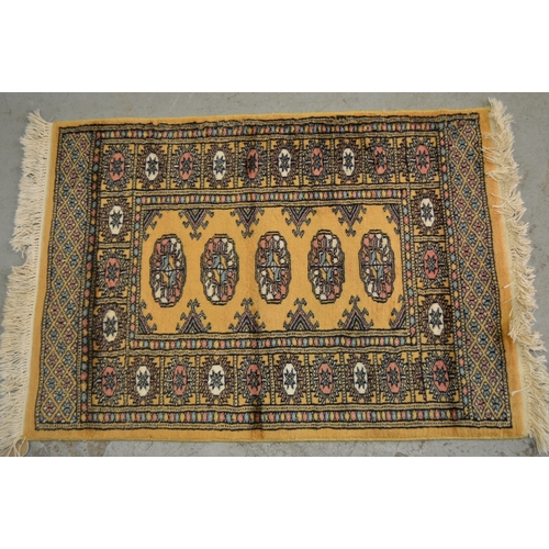 149 - Small Pakistan runner of Turkoman design, 170 x 62, together with a similar smaller beige ground rug