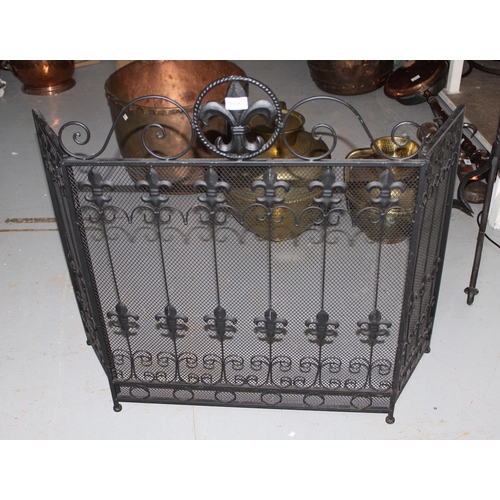 1696 - Black painted wrought iron triple section fire screen together with a brass telescopic standard lamp... 