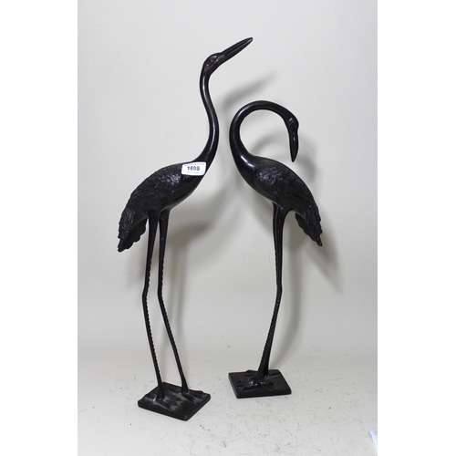 1698 - Two Japanese patinated bronze figures of cranes, the tallest 61cm high