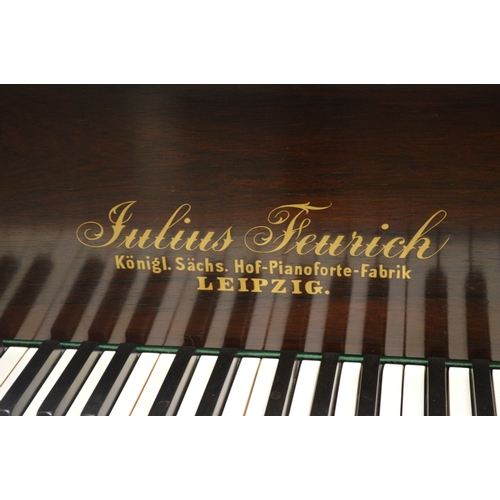 1933 - Julius Feurich of Leipzig, rosewood cased baby grand piano with ivory keys raised on turned fluted t... 