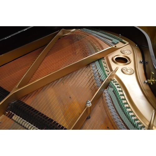 1933 - Julius Feurich of Leipzig, rosewood cased baby grand piano with ivory keys raised on turned fluted t... 