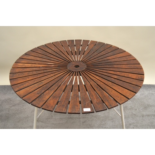 2020 - BKS (Daneline), two circular teak garden tables with white painted steel bases, 98cm diameter, toget... 