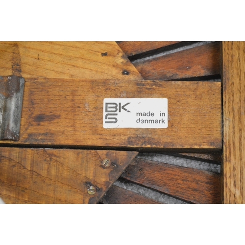 2020 - BKS (Daneline), two circular teak garden tables with white painted steel bases, 98cm diameter, toget... 