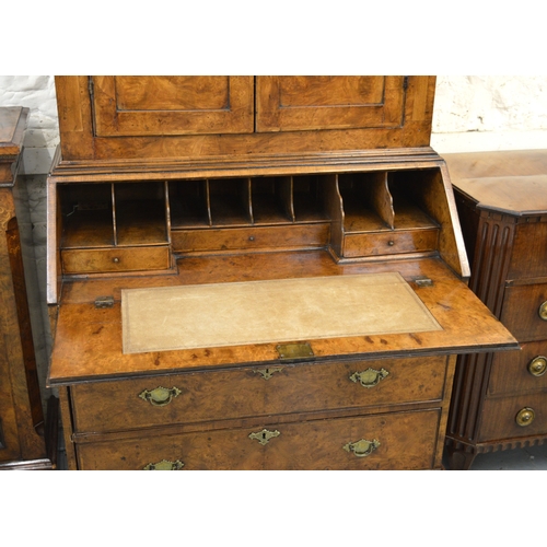 2063 - Antique burr elm bureau bookcase with moulded cornice above two panelled doors, the base with a fall... 