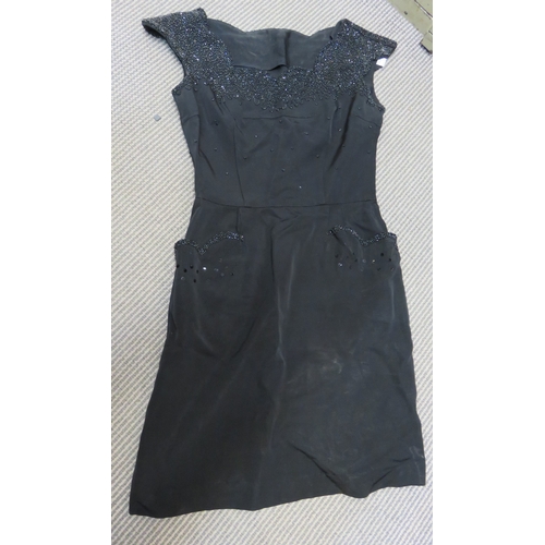 210 - Ladies 1950s black dress, together with a vintage negligee, two leather tie cases, box of various mo... 