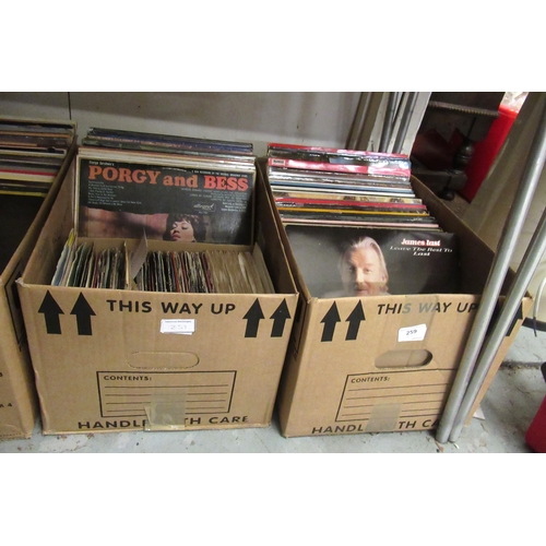 259 - Four boxes containing a large collection of various 20th Century records, including various LPs and ... 