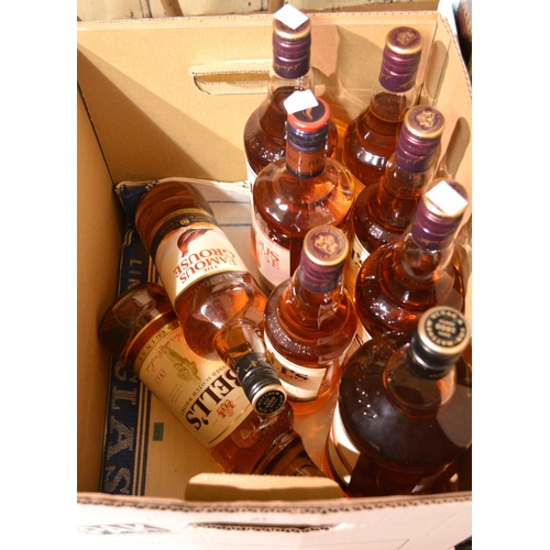 27 - Nine various blended whiskies, mainly Bells