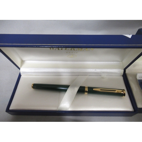 317 - Two cased Waterman fountain pens, together with two other pens