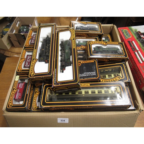 534 - Box containing a quantity of Mainline Railways 00 gauge rolling stock, including four various tank e... 