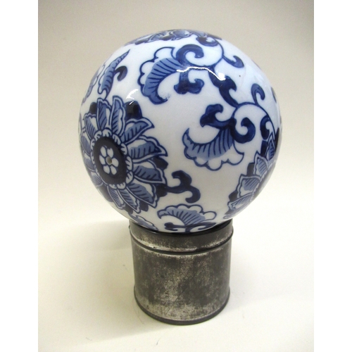 752 - Modern Fabergé gilt decorated ruby glass egg, 7.5cm high, together with a blue and white pottery car... 