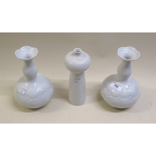 762 - Pair of Weiss Meissen porcelain vases each with a narrow baluster neck and relief decorated body, bl... 