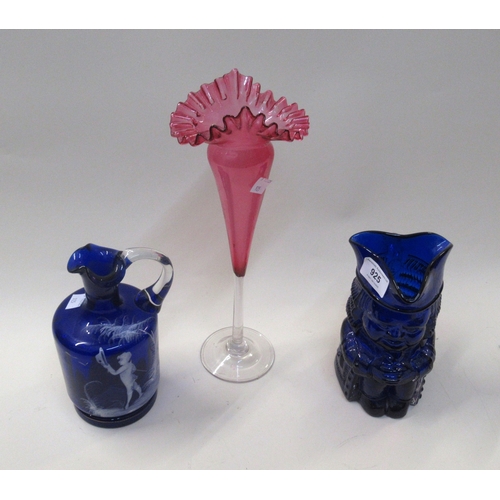 925 - Cranberry glass pedestal vase, a Bristol blue glass Toby jug, together with a Mary Gregory style blu... 