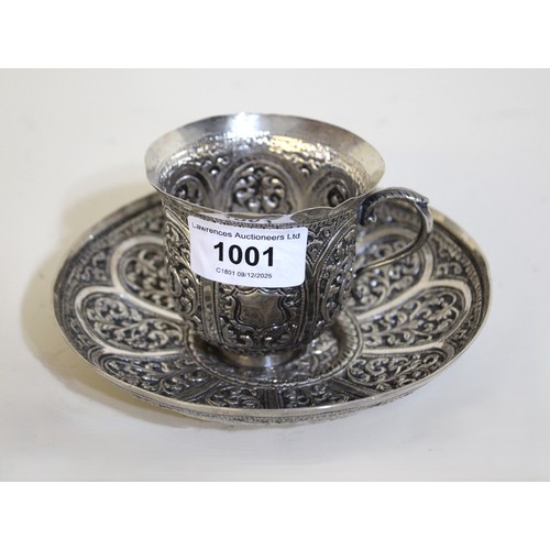 1001 - Indian floral embossed white metal cup and saucer, 6.6oz t