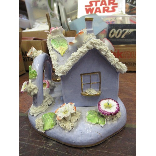 927 - 19th Century English floral encrusted pastille burner cottage with stand, and a small quantity of ot... 