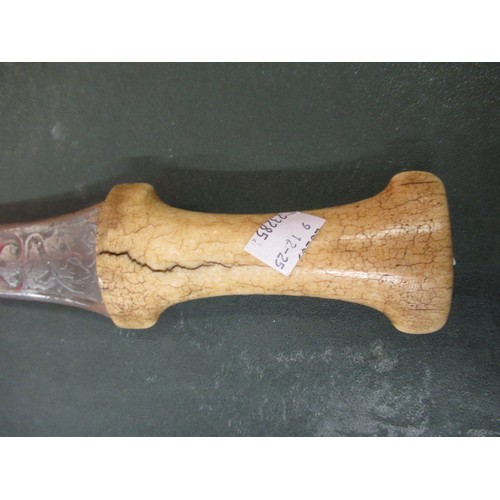 601 - Antique ceremonial sword, together with an Eastern dagger with bone handle and a policeman's trunche... 