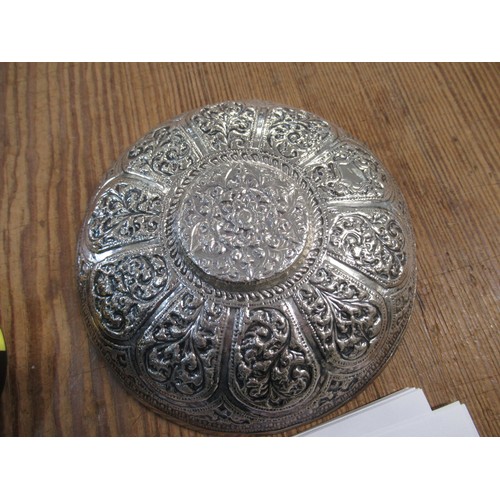 1001 - Indian floral embossed white metal cup and saucer, 6.6oz t