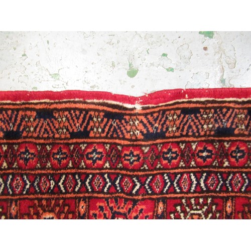 145 - Pakistan Tekke design rug having multiple borders on a dark red ground, 155 x 123cm