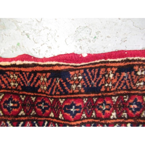 145 - Pakistan Tekke design rug having multiple borders on a dark red ground, 155 x 123cm