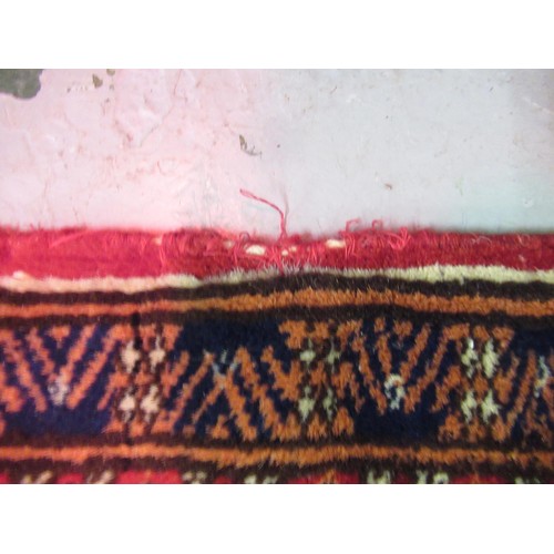 145 - Pakistan Tekke design rug having multiple borders on a dark red ground, 155 x 123cm
