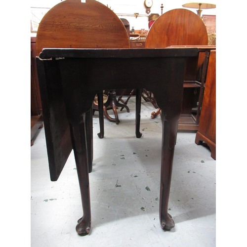 2112 - George II mahogany dining table with a single drop-leaf above a plain frieze on carved tapering supp... 