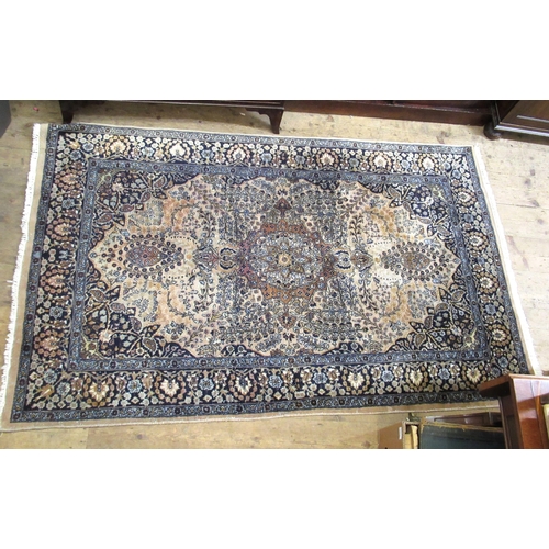 11 - Indo Persian woollen rug of centre medallion and all-over floral design on a beige ground, 199 x 124... 