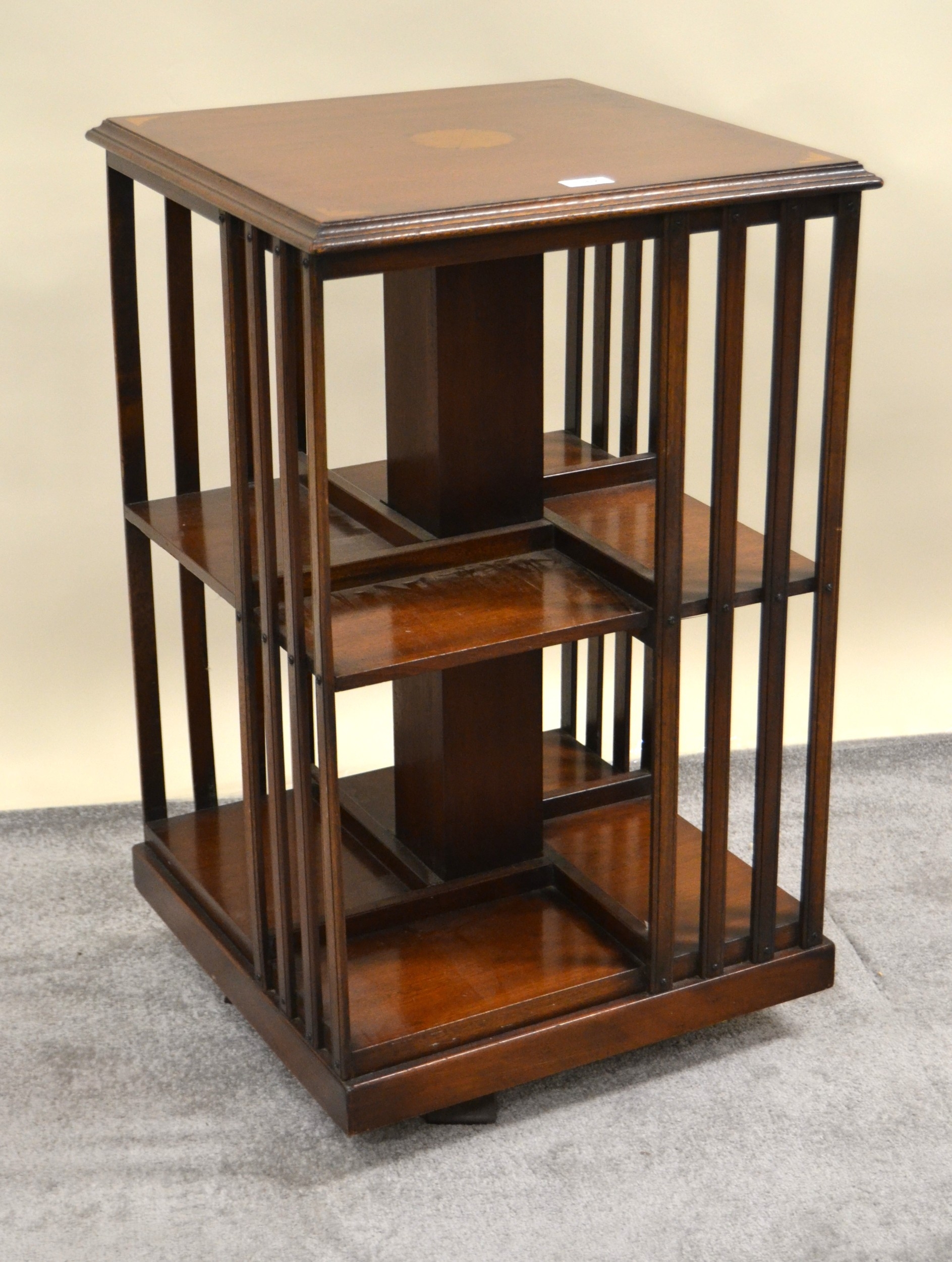 Reproduction mahogany and inlaid revolving bookcase with slatted sides ...