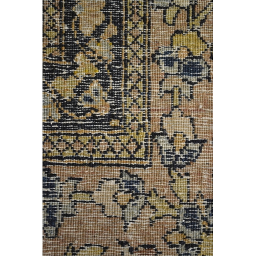 14 - Tabriz rug with a vase, tree of life and animal design on a pale ground with borders (damages and we... 