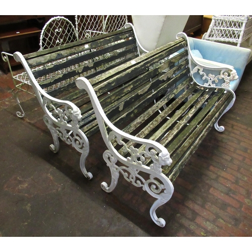 1540 - Pair of white painted and cast iron slatted garden benches, 125cm wide, together with a similar rect... 