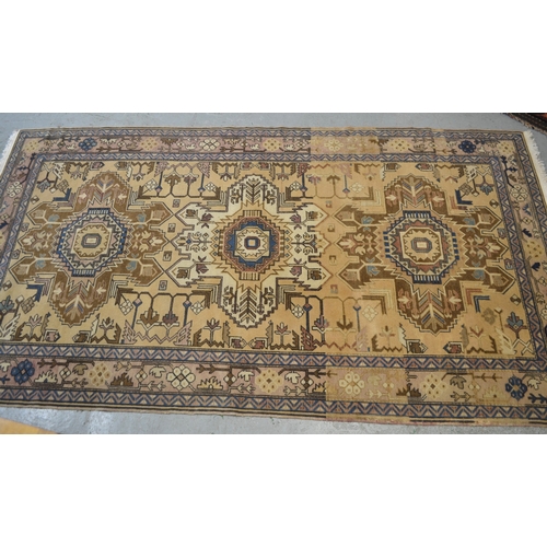 18 - Kurdish rug with triple medallion design on a beige ground with borders, 226 x 125cm approximately