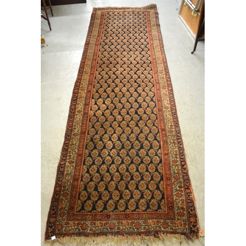 19 - Good quality central Persian runner, with an all over boteh design on a midnight blue ground with bo... 