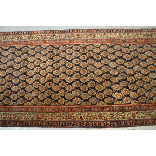 19 - Good quality central Persian runner, with an all over boteh design on a midnight blue ground with bo... 