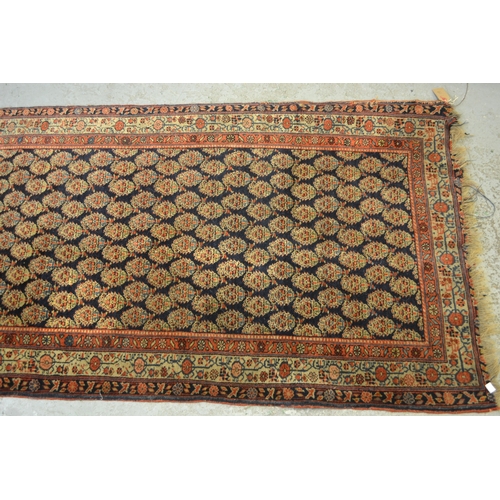 19 - Good quality central Persian runner, with an all over boteh design on a midnight blue ground with bo... 