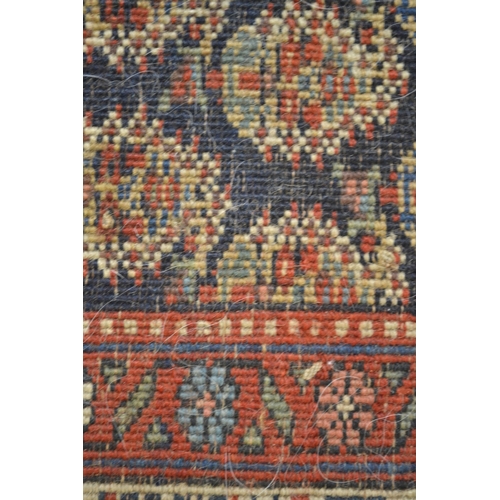 19 - Good quality central Persian runner, with an all over boteh design on a midnight blue ground with bo... 