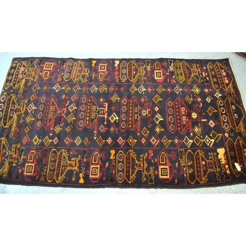 20 - Afghan war rug woven in typical dark shades, the design incorporating various tanks, helicopters etc... 
