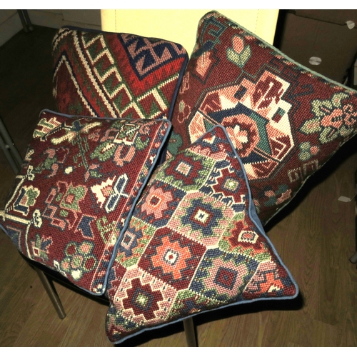 38 - Group of four woolwork Kelim style cushions having geometric design covers