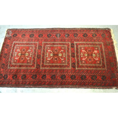 4 - Afghan rug with a triple square medallion design on a red ground, 173 x 94cm (damages), together wit... 