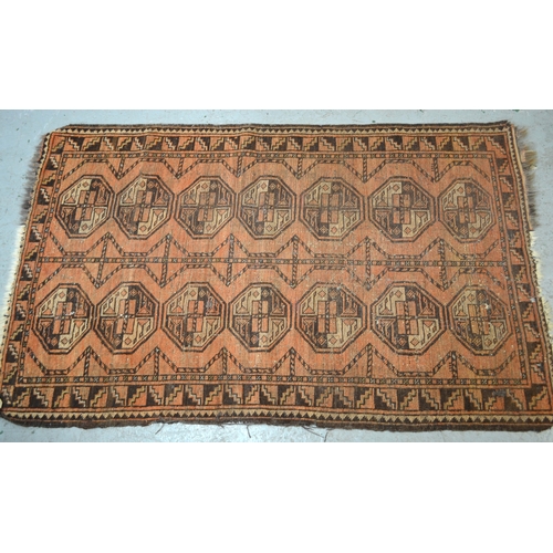 4 - Afghan rug with a triple square medallion design on a red ground, 173 x 94cm (damages), together wit... 