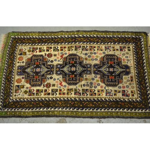 5 - Small Belouch rug with a triple medallion design on a cream ground with border, 140 x 83cm approxima... 