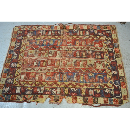 7 - Antique South West Persian rug with a banded meander design in shades of red, blue, yellow, cream an... 