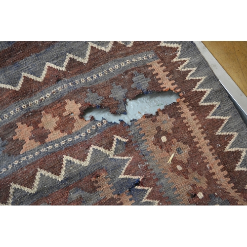 7 - Antique South West Persian rug with a banded meander design in shades of red, blue, yellow, cream an... 