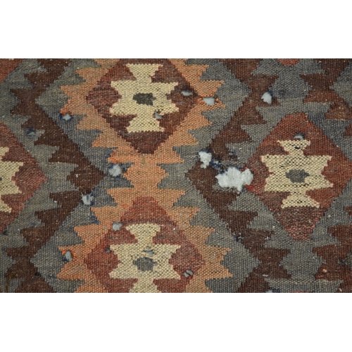 7 - Antique South West Persian rug with a banded meander design in shades of red, blue, yellow, cream an... 