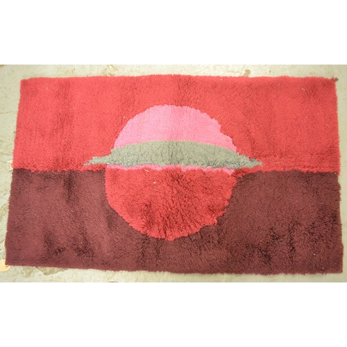 9 - Three mid Century long pile rugs, the largest 118 x 69cm