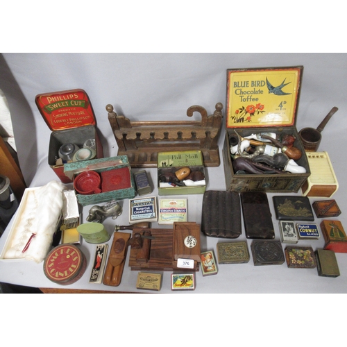 376 - Various smoking related items, including tobacco tins, matchbox holders, pipe racks and stands etc.