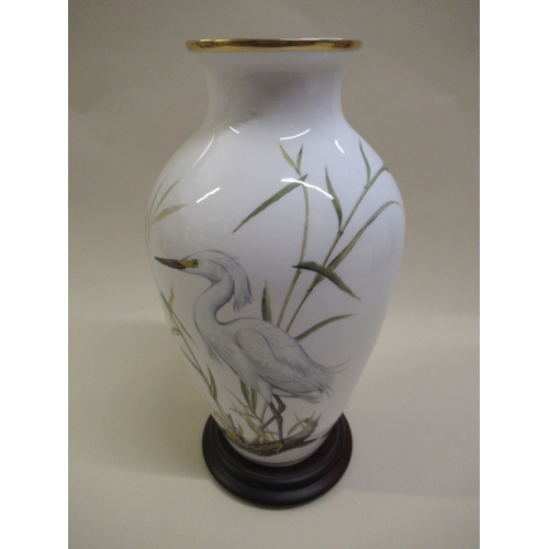 481 - Group of five Franklin Mint baluster form vases with bird and floral decoration, each with a hardwoo... 