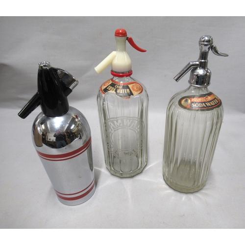 317 - Two vintage glass soda syphons, together with a 1960s chrome and red (Sparkets) syphon