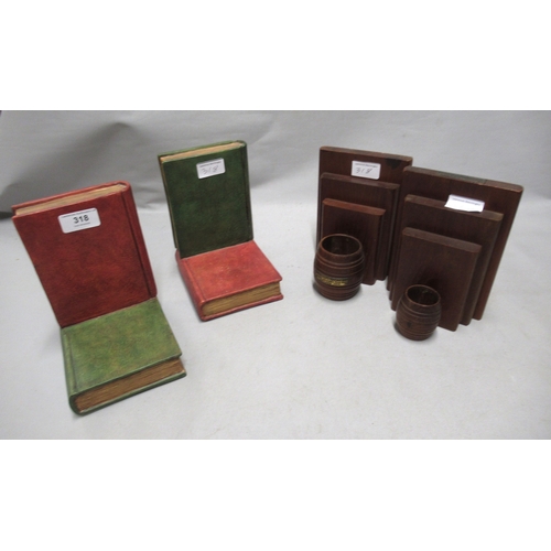318 - Pair of teak bookends made from timber from HMS Jutland 1916, together with a pair of pottery book f... 