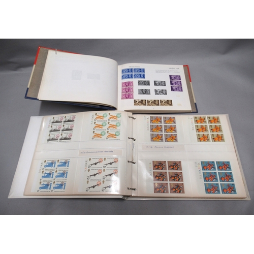 323 - Four albums containing a collection of mid / late 20th Century stamps, many in blocks