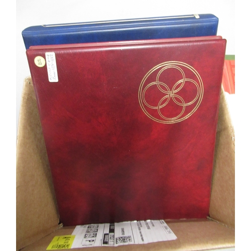 323 - Four albums containing a collection of mid / late 20th Century stamps, many in blocks